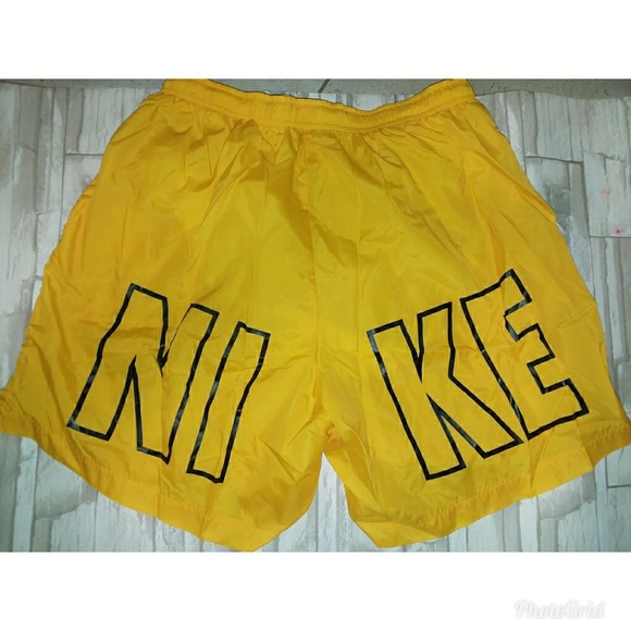 yellow nike swim trunks